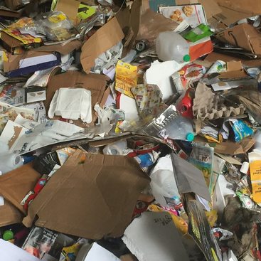 pile of commingled plastic and paper recycling