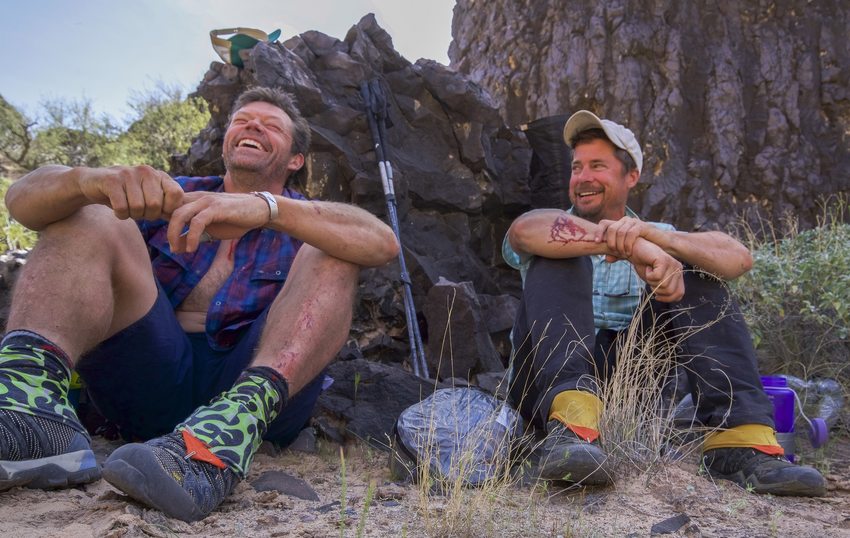 Pete McBride and Kevin Fedarko sitting in the Grand Canyon