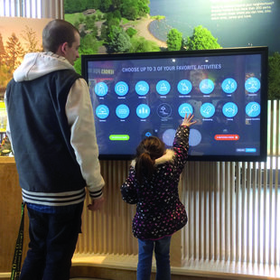 father and son using interactive park finder map at Oregon Zoo Education Center