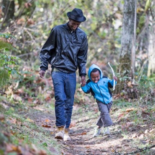 man and boy walking on trail at Oxbow Regional Park