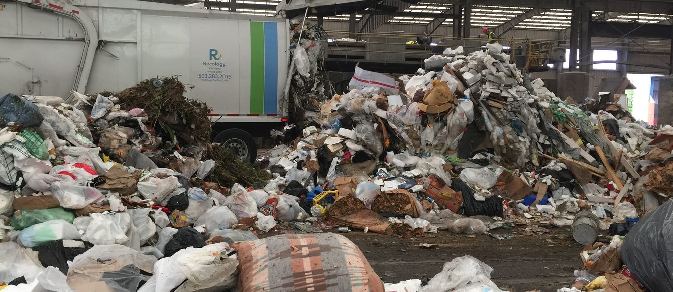 garbage truck emptying its load at Metro's Central transfer station