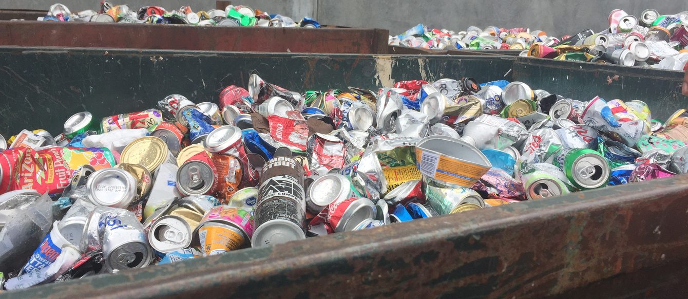 photo of aluminum cans in recycling bin