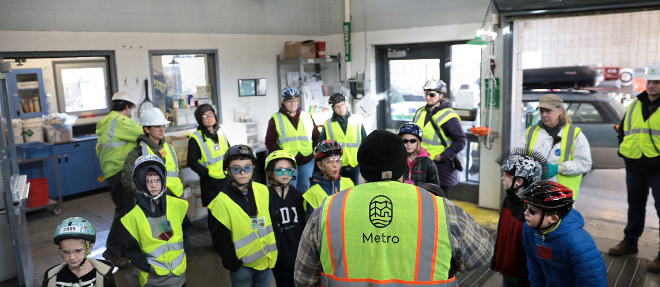 a group of kids steps inside a hazardous waste facility 
