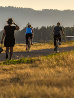 People walking and biking on a trail