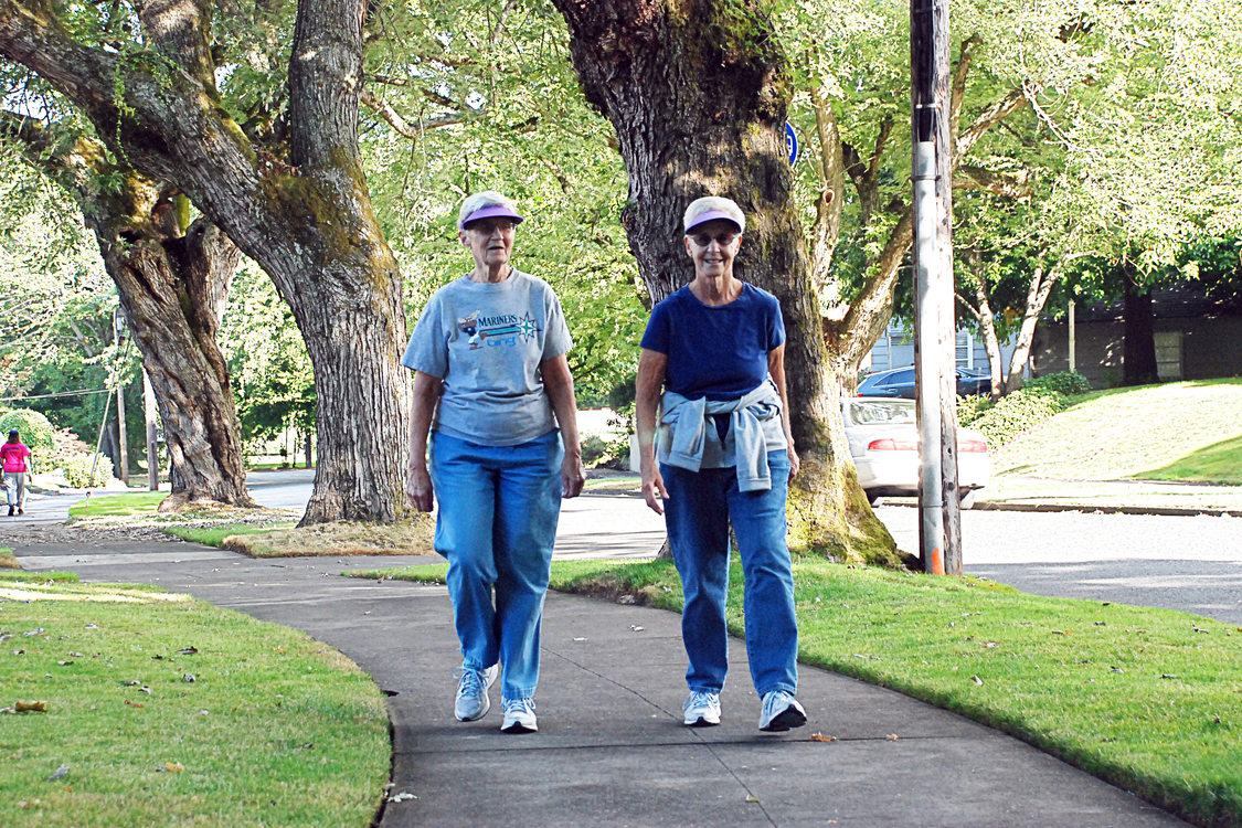 Seniors walking on path