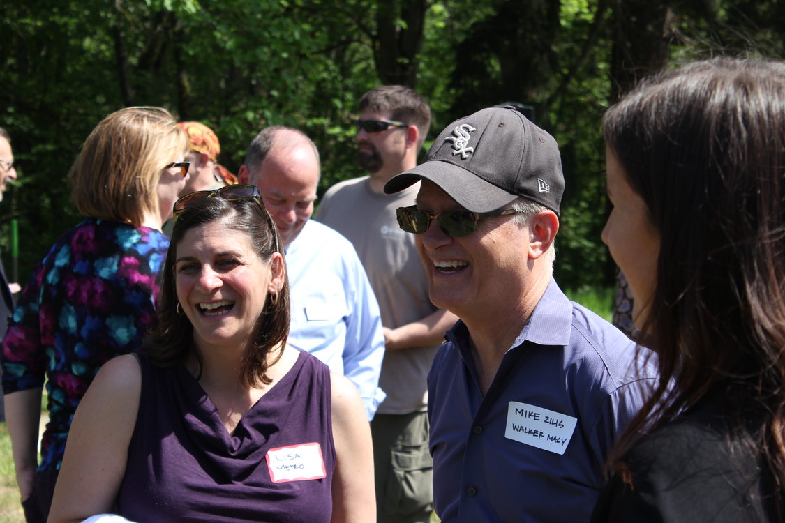 Community members and government officials chat at Orenco Woods' groundbreaking.