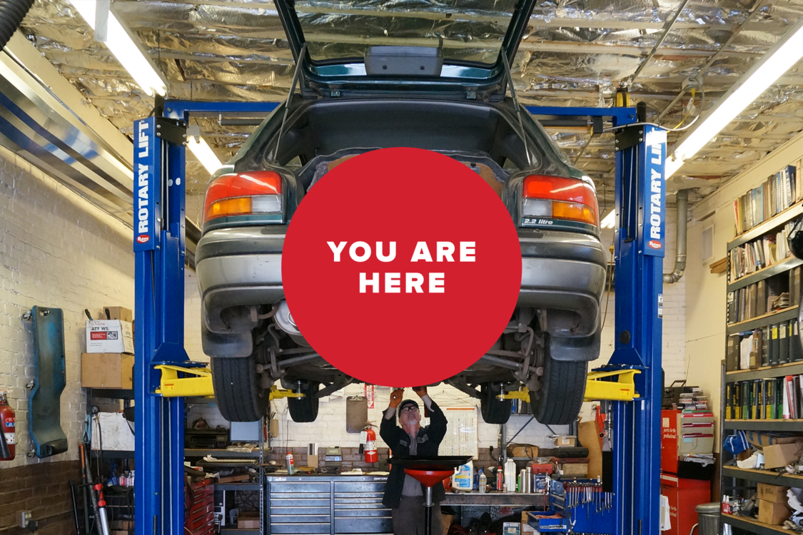 You are here: Man fixing car