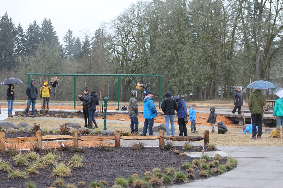 photo of people near the playground structure at Orenco Woods Nature Park
