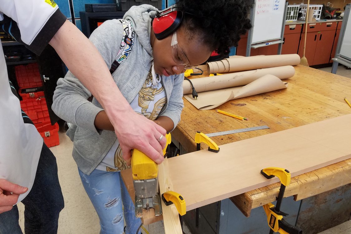 photo of George Middle School student building a boat