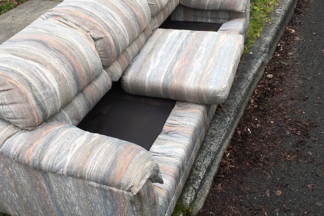 couch on curb missing cushions