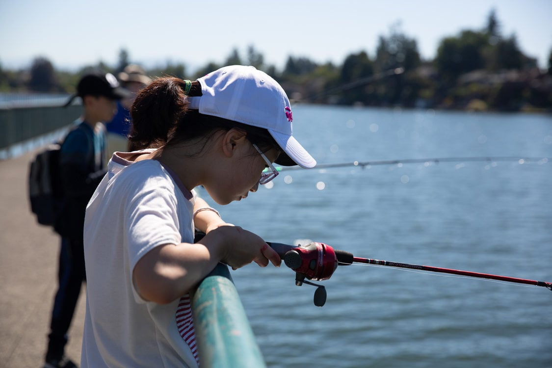A Korean exchange student fishing at Blue Lake Regional Park
