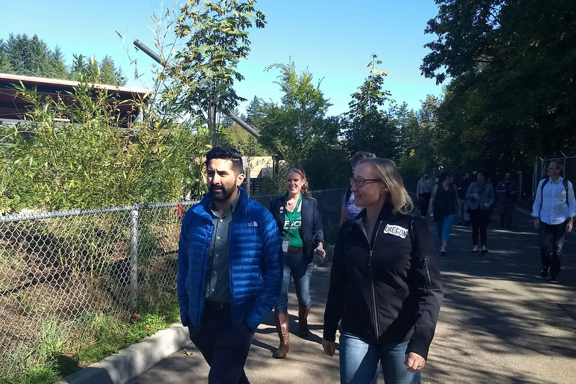 Metro Council President Lynn Peterson and Councilor Juan Carlos Gonzalez walking through Oregon Zoo