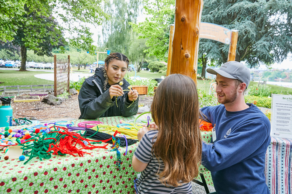 child making crafts at a table in Blue Lake Discovery Garden