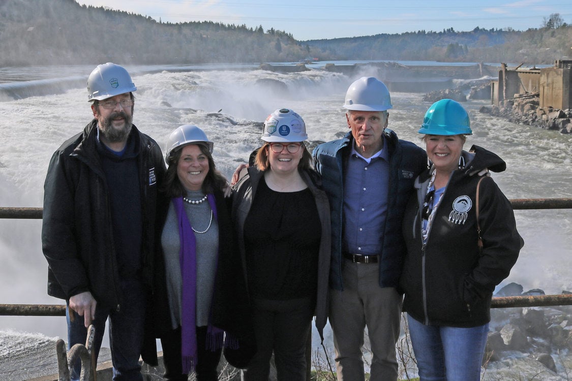 Metro Councilor Christine Lewis stands with other elected officials in front of Willamette Falls in Oregon City