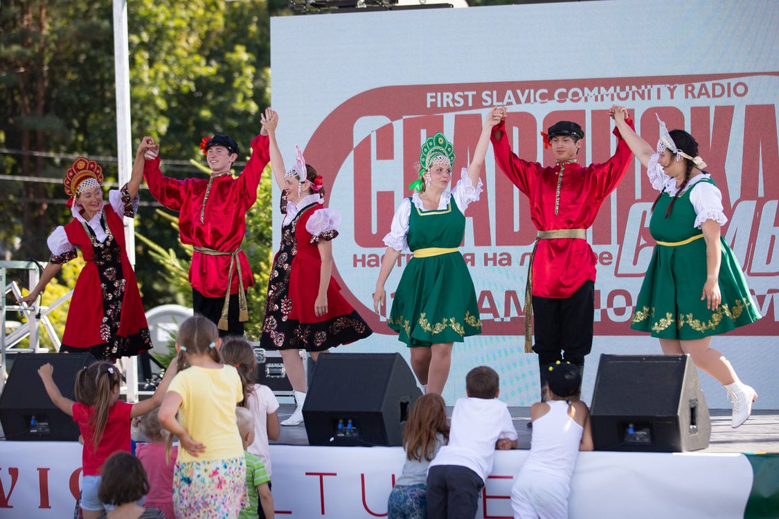 performers in brightly-colored clothing on a stage at the 12th annual Slavic Festival