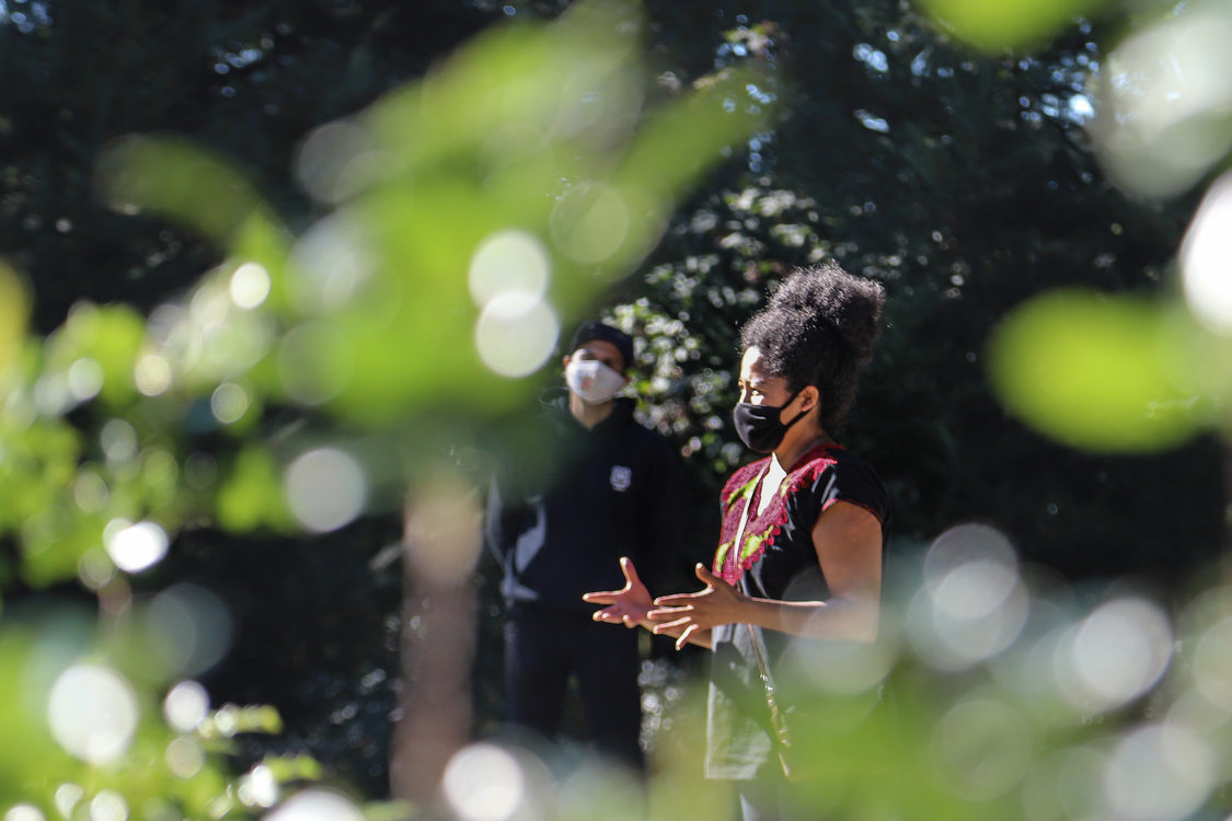 A Metro educator wearing a mask addresses a group of people at Scouters Mountain Nature Park 